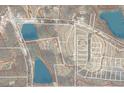 Aerial view showing property lines and nearby bodies of water at 1917 New Hill Olive Chapel Rd, New Hill, NC 27562
