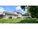 House's rear view, showcasing a deck, and partially visible garage at 1525 Marshburn Rd, Wendell, NC 27591