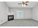 Bright living room featuring a fireplace and access to a balcony at 333 Glenolden Ct, Cary, NC 27513