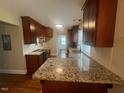 Renovated kitchen with granite counters and stainless steel appliances at 2591 Us 301, Dunn, NC 28334