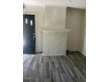 Living room with fireplace and wood-look floors at 1222 Hargrove St, Rocky Mount, NC 27801