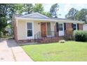 Brick ranch house with a newly painted exterior at 1318 Timothy Avenue Ave, Durham, NC 27707