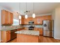 Kitchen with granite countertops, stainless steel appliances, and an island at 216 Stoney Dr, Durham, NC 27703
