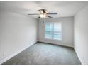 Bedroom with gray carpeting and ceiling fan at 70 Hilldebrant Dr, Franklinton, NC 27525