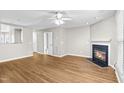 Living room with fireplace and hardwood floors at 204 Knightsborough Way, Apex, NC 27502