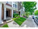 Townhome entrance with sidewalk and street view at 128 Dove Cottage Ln, Cary, NC 27519
