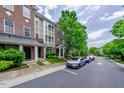 Townhome community with street view and parked cars at 128 Dove Cottage Ln, Cary, NC 27519