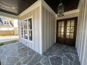 Elegant front entry with a double door and stone flooring at 40 Spanish Oak Dr, Youngsville, NC 27596