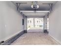Spacious garage interior with an open overhead door and neutral walls at 508 East End Ave, Durham, NC 27703