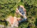 Aerial view of a house under construction situated on a wooded lot at 8780 Old Nc 86, Chapel Hill, NC 27516