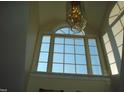 Bright landing area with a large window and a chandelier at 334 Ira B Tart Rd, Dunn, NC 28334