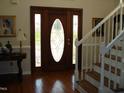 Elegant entryway with hardwood floors, a stained glass door, and a staircase at 334 Ira B Tart Rd, Dunn, NC 28334