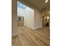Light and spacious entryway with hardwood floors and a view of the staircase at 6030 Preacher Hayes Rd, Mebane, NC 27302