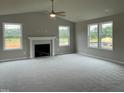 Large living room with fireplace and high ceilings at 83 Oakfield Trace Dr, Four Oaks, NC 27524