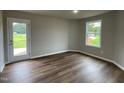 Bonus room with door leading to outside at 83 Oakfield Trace Dr, Four Oaks, NC 27524