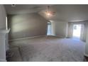 Spacious living room with vaulted ceiling and fireplace at 47 Oakfield Trace Dr, Four Oaks, NC 27524