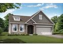 Ranch style home with gray siding, stone accents, and two-car garage at 40 Sawtooth Oak Ln, Youngsville, NC 27596