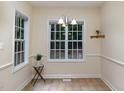 Bright dining area with large windows and a chandelier at 140 Applegate Dr, Franklinton, NC 27525