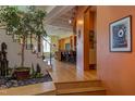 Open concept living space with hardwood floors and unique artwork at 103 W Main St # 405, Durham, NC 27701
