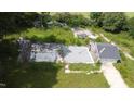 Aerial view of lot with partial demolition and existing garage at 1304 Shade Tree Rd, Benson, NC 27504