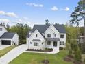 Aerial view of two story white brick house at 2506 Silas Peak Ln, Apex, NC 27523