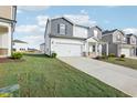 Two-story house with gray and white siding, and a two-car garage at 290 White Birch Ln, Angier, NC 27501