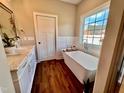Spa-like bathroom with a soaking tub and double vanity at 3701 Greystone Dr, Rocky Mount, NC 27804