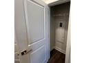 White utility closet with shelving and water heater at 11549 Helmond Way # 102, Raleigh, NC 27617