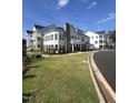 Modern townhome community with ample green space at 11549 Helmond Way # 102, Raleigh, NC 27617