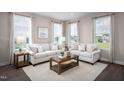 Bright living room with two sofas and a coffee table at 1218 Helms St, Durham, NC 27713