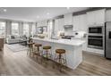 Open concept kitchen with island and stainless steel appliances. Living room view at 1226 Helms St, Durham, NC 27713
