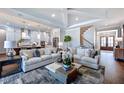 Open living room with high ceilings and access to kitchen at 2865 Silk Hope Gum Springs Rd, Pittsboro, NC 27312