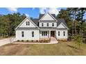 Two story home with gray siding and landscaping at 825 Crimson Rdg Trl, Fuquay Varina, NC 27526