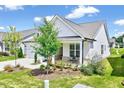 Modern farmhouse exterior with landscaped yard at 1541 Adonis Blue Way, Fuquay Varina, NC 27526