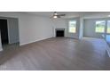 Bright living room featuring a fireplace and wood-look floors at 231 Lotus Ave, Smithfield, NC 27577