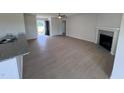 Spacious living room with fireplace and laminate flooring at 231 Lotus Ave, Smithfield, NC 27577