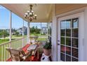 Relaxing screened porch with wicker furniture at 19 Silverside Dr, Angier, NC 27501