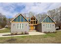 Modern home with gray siding and unique design at 1203 Keith Hills Rd, Lillington, NC 27546