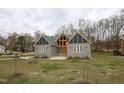 Modern home with gray siding and unique design at 1203 Keith Hills Rd, Lillington, NC 27546