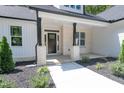 Front porch with stone columns and walkway at 114 Shaman Dr, Louisburg, NC 27549