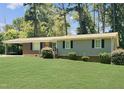 Brick ranch home with a large grassy yard at 2400 Carbonton Rd, Sanford, NC 27330