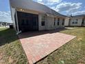 Brick patio and screened-in porch with backyard view at 3192 Castlerock Dr, Burlington, NC 27215