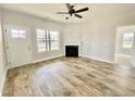 Bright living room features hardwood floors, fireplace, and neutral walls at 36 Kevior Ave, Four Oaks, NC 27524