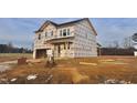 New home construction showing house wrap and landscaping at 8809 Melvin St # 34, Willow Springs, NC 27592