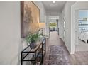 Bright hallway with glass-top console table at 2209 Fletchers Ridge Dr, Durham, NC 27703