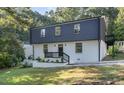 Newly renovated two story home with black and white exterior at 2113 Eveton Ln, Sanford, NC 27330