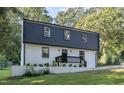 Newly renovated two story home with black and white exterior at 2113 Eveton Ln, Sanford, NC 27330