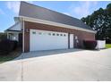 Spacious two-car brick garage with ample driveway space at 107 Knottingham Ct, Dunn, NC 28334