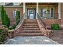 Brick front exterior with a charming staircase and landscaping at 3105 W Hampton Dr, Rocky Mount, NC 27804