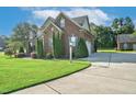 Brick house exterior with driveway and landscaping at 3105 W Hampton Dr, Rocky Mount, NC 27804
